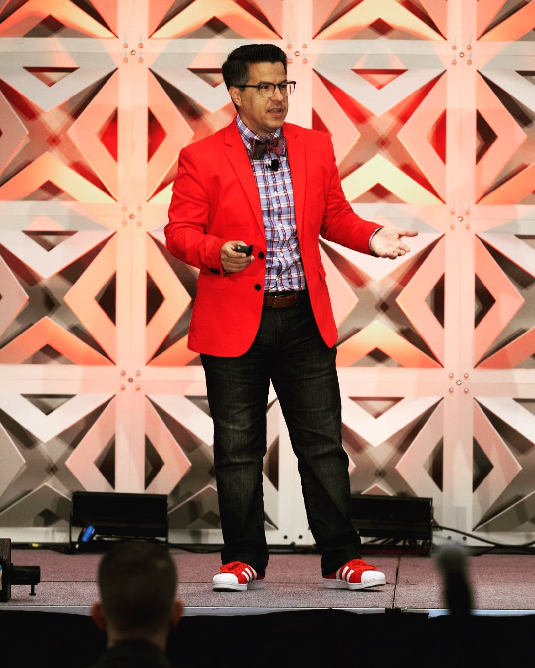 photo of andy delao speaking at a conference