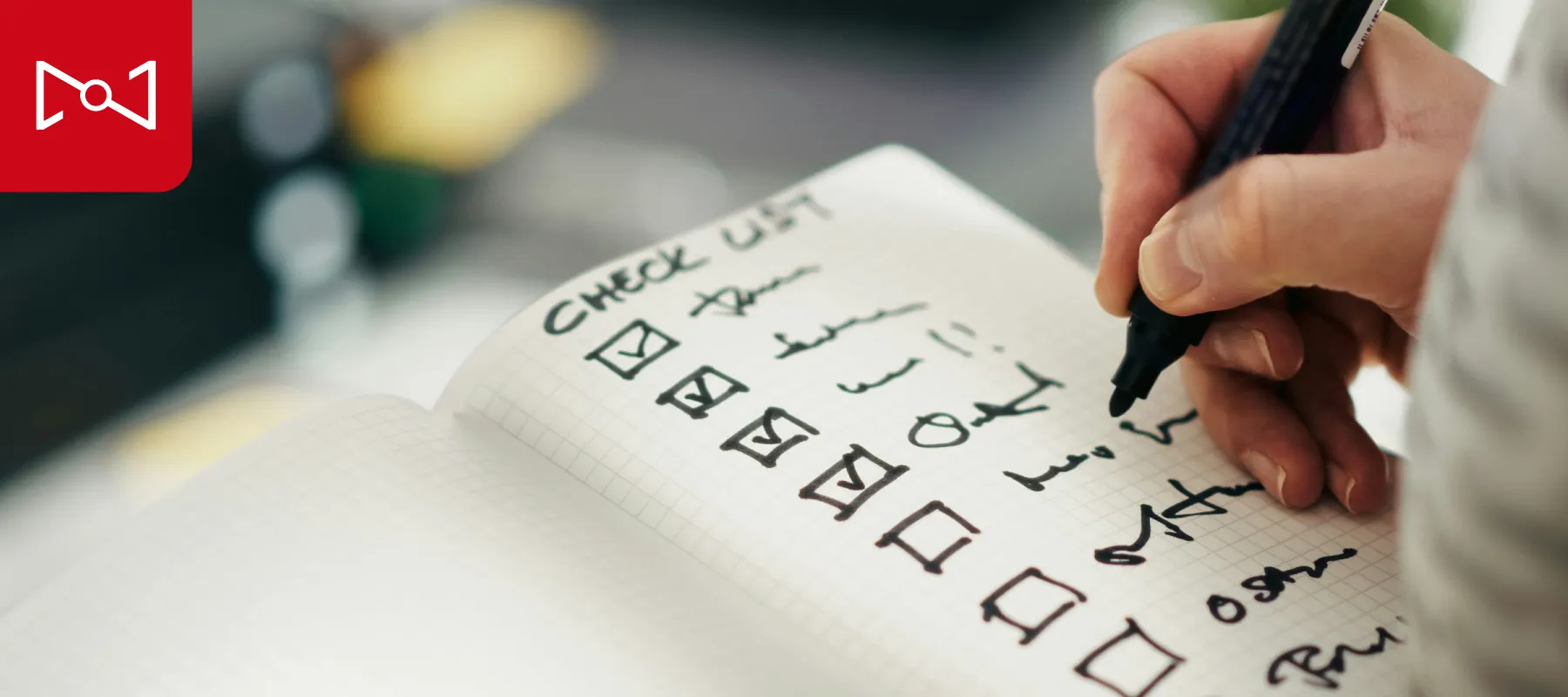 an image of a person writing on a piece of paper. 2026 Marketing Talent AI Report