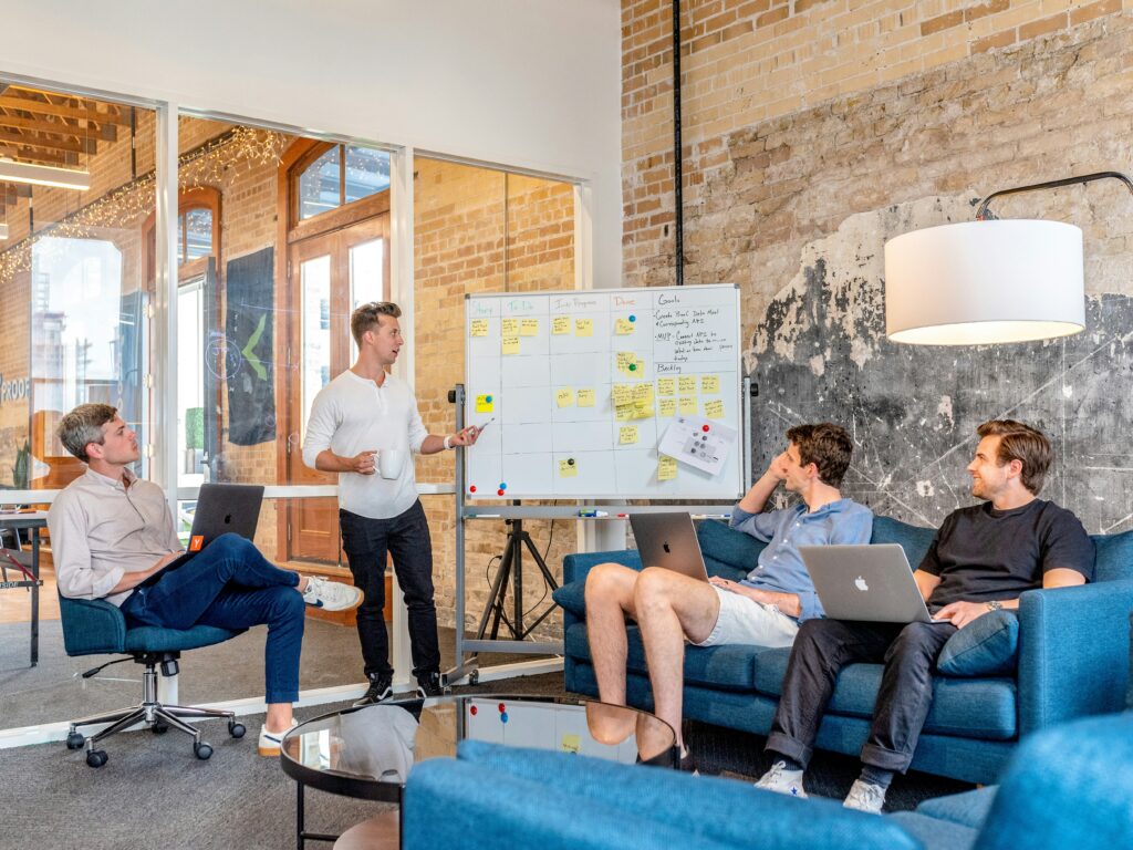Team collaborating in a modern office, building workforce resilience through open discussion and systems support.